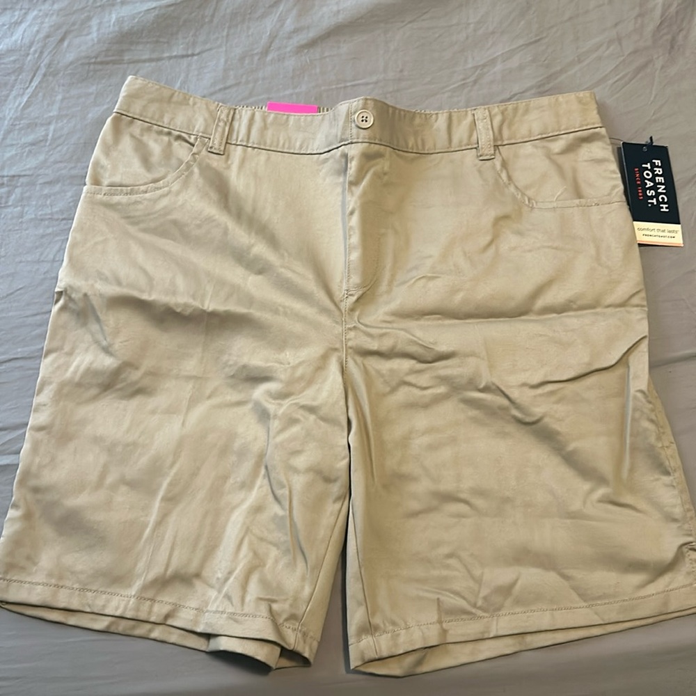 These are new, never worn khaki bermuda shorts from the brand “French Toast”.